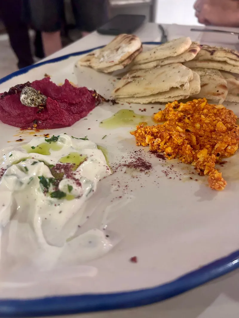 Tzatziki, beetroot hummus and tyrokafteri with pita