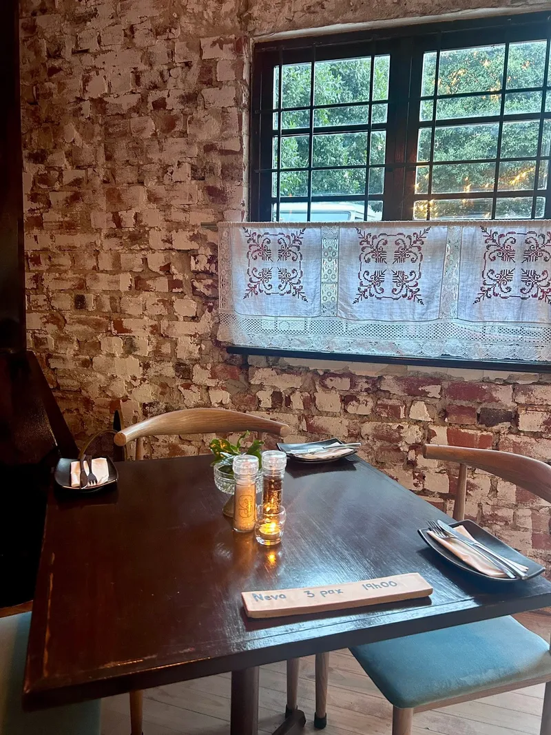 A candlelit table by the window