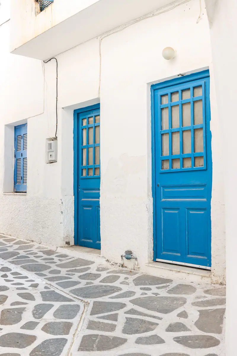 Blue doors on a whitewashed island street
